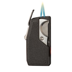 May include: A black and silver lighter with a textured grip and a blue and yellow flame. The lighter has a built-in cigar cutter and a metal trigger.