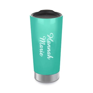 May include: A teal travel mug with a silver lid and base. The mug has the name "Hannah Marie" printed on the side in white.