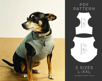 May include: A PDF pattern for a dog shirt in three sizes: L, XL, and XXL. The pattern is from Columbus Apparel Studio. The image also shows a small black and brown dog wearing a gray shirt.