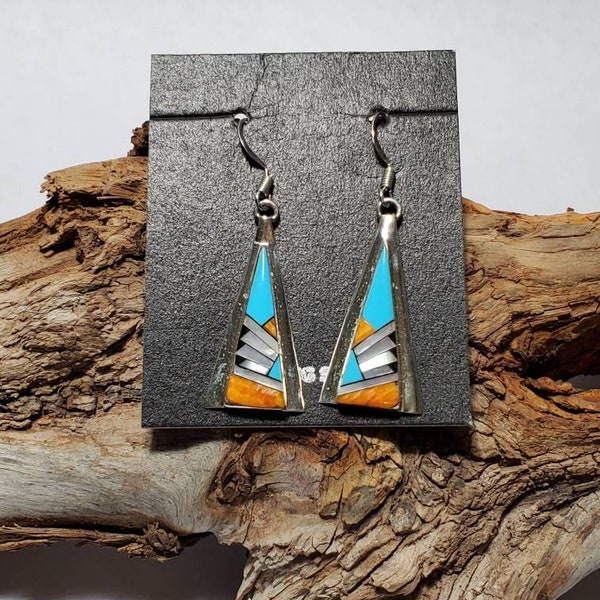 Inlay earrings with turquoise, orange spiny oyster shells, mother of pearl, and onyx. Sterling earrings inlay with multi stones.