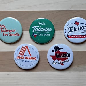 May include: A collection of five campaign buttons with the name "Talarico" and the phrase "For Senate." The buttons are round and feature various designs, including the Texas state outline and the text "Vote James Talarico."