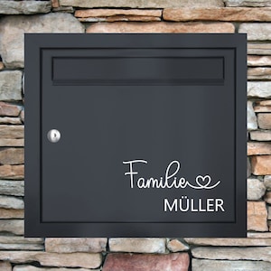 May include: Black mailbox with a white vinyl sticker that says "Familie MÜLLER" with a heart symbol.