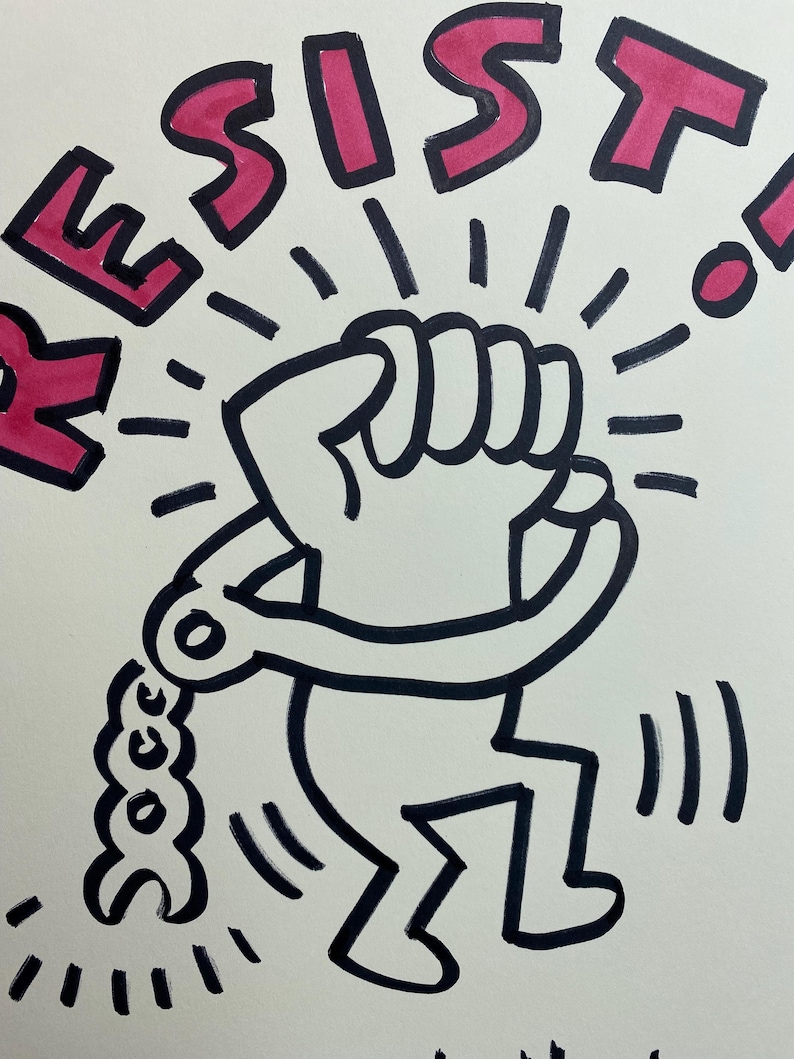 May include: Black and white illustration of a figure breaking free from shackles, with the word "RESIST" in pink above. The figure has a raised fist, radiating lines, and is in motion.