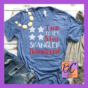 May include: A blue t-shirt with a white star design and the text "Time to get star spangled hammered" in red.