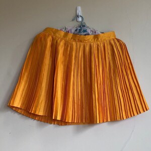 Orange netball skirt sales