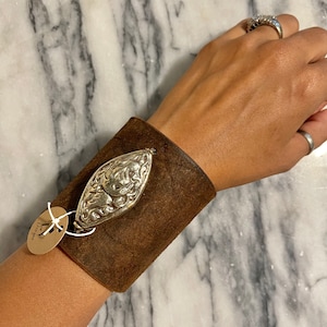Beautiful up-cycled genuine leather cuff bracelet with Tibetan Silver pendant. #LC14