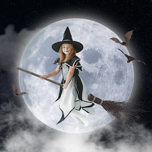 May include: A young witch in a black and white costume flies on a broomstick in front of a full moon. She is wearing a black witch hat and has a painted face. Bats fly around her.