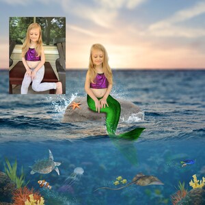 May include: A young girl dressed as a mermaid sits on a rock in the ocean. She is wearing a purple top and a green tail. The water is blue and there are some starfish and other sea creatures in the background.