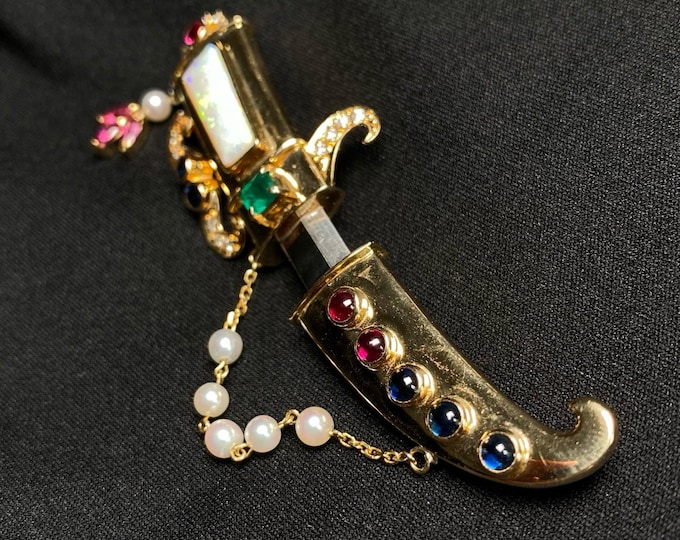 One of a kind knife brooch set in 18k gold made with natural Australian opal, sapphires, rubies, pearls and  emeralds. Unique luxury jewelry