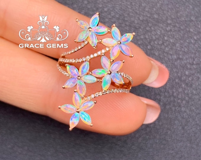 This is a custom five flower opal necklace with chain