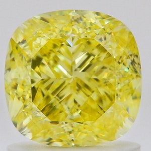 May include: A cushion-cut yellow diamond gemstone with a bright, faceted surface.