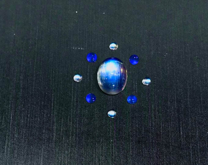 custom moonstone ring with tanzanites and moonstones side stones