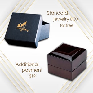 May include: Two jewelry boxes, one black with the text "matrice jewelry" and the other brown. The black box is labeled "Standard jewelry BOX for free" and the brown box is labeled "Additional payment $19".