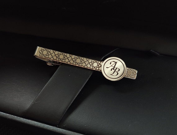 A sterling silver personalized tie bar is an underrated men's accessory that feels genuinely luxurious and is rarely gifted — solid demand signal confirms it.