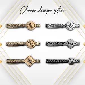 May include: Six different tie bar designs with various patterns and initials. The tie bars are gold and silver in color. Choose design option 1 through 6.