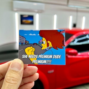 She Needs Premium Dude Sticker