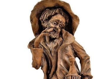 The cheerful old man, the clay sculpture