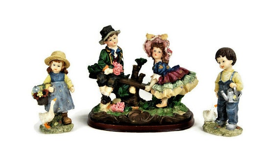 4 beautiful decorative figures ( maybe Hummel/Goebel )