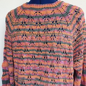 Hand-knitted summer sweater in openwork pattern with gradient yarn in orange, pink, purple and khaki, in comfortable raglan, with wide sleeves