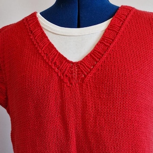 Hand-knitted red short V-neck sweater made of cotton