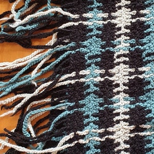 Beautiful large crochet stole with black, white and petrol-coloured checks made of soft pure new wool, size 210 x 55 cm