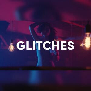 May include: Image with the word "GLITCHES" in white block letters. A person is in the background with their arm raised. Two light bulbs hang from the ceiling, illuminating the scene with a warm glow. The background is a mix of purple and blue.