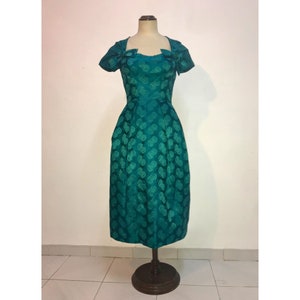 Green brocade cocktail dress with bows at the neckline 1950