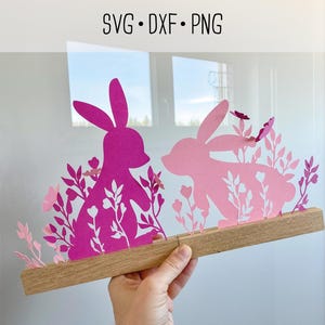 May include: A set of three ceramic mugs with a speckled, matte finish. The mugs are in shades of cream, light gray, and dark gray. Each mug has a simple, minimalist design, perfect for coffee or tea.