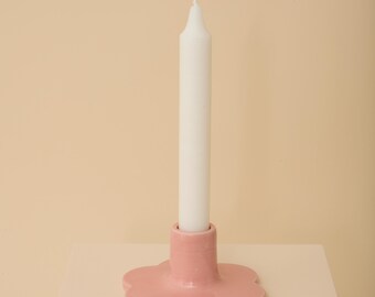 Pink handmade ceramic candle holder with scalloped edge