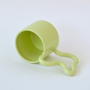 Green handmade ceramic mug with wiggle handle image 2