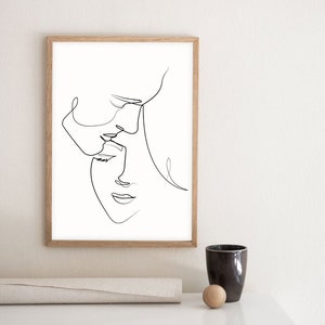 May include: A black and white line drawing of two faces, one above the other, in a minimalist style. The faces are drawn in a single continuous line.