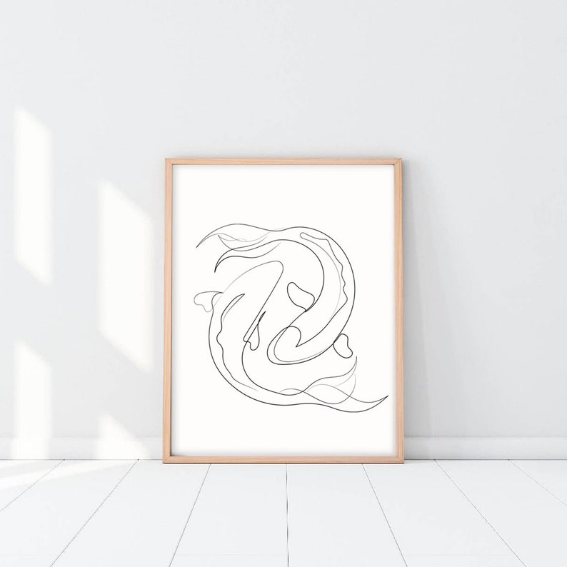 May include: A black and white line drawing of two fish swimming in a circle, framed in a light wood frame.