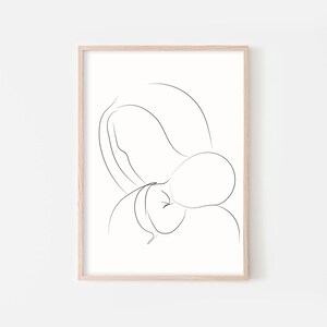 May include: A black and white line drawing of a person holding a baby in their arms. The drawing is simple and minimalist, with only the outlines of the figures visible.