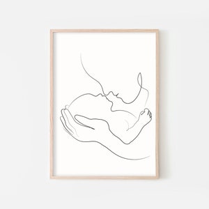 May include: A single-line drawing of a parent holding a baby in their arms. The parent is kissing the baby's forehead.