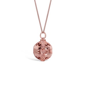 Rose Gold Locket Necklace in vintage style closed on white background
