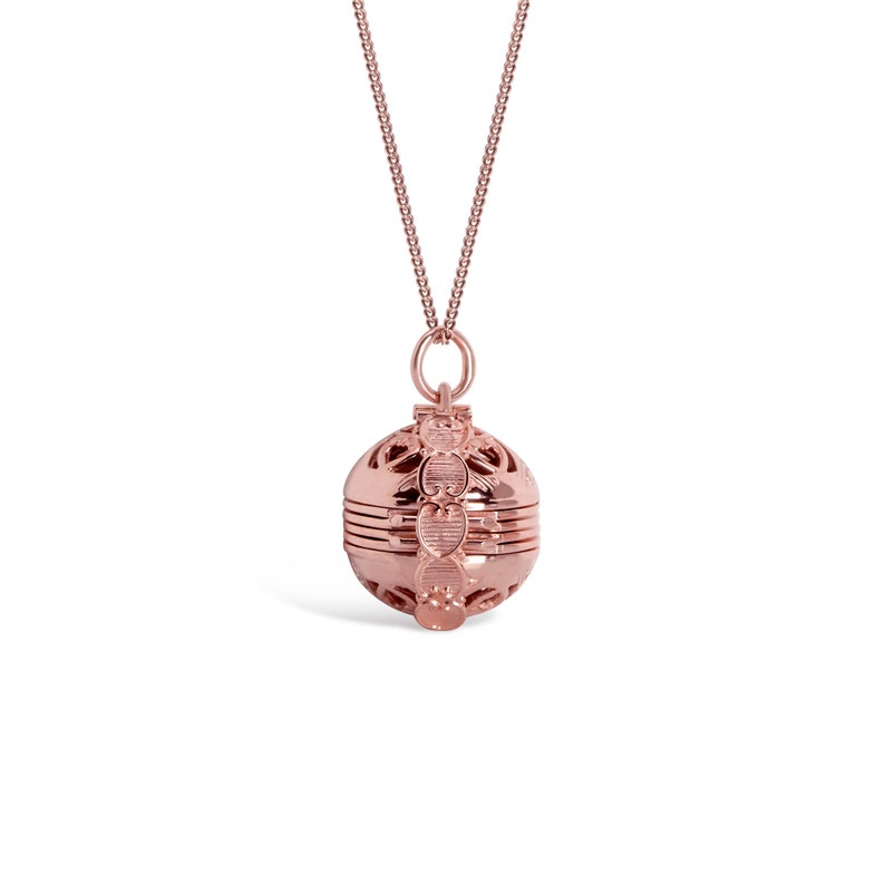 Rose Gold Locket Necklace in vintage style closed on white background