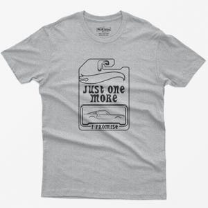 May include: Gray t-shirt with a black graphic of a car tag that says "Just one more I promise".