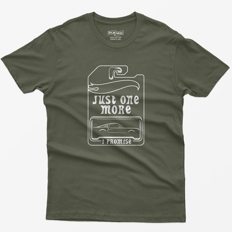 May include: A green t-shirt with a white graphic of a car and the text "Just one more I promise".