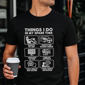 May include: A black t-shirt featuring white text and graphics titled THINGS I DO IN MY SPARE TIME. The design includes six boxes depicting sim racing activities: race in my sim, watch sim racing videos, upgrade my rig, tune my settings, talk about sim racing, and think about sim racing.