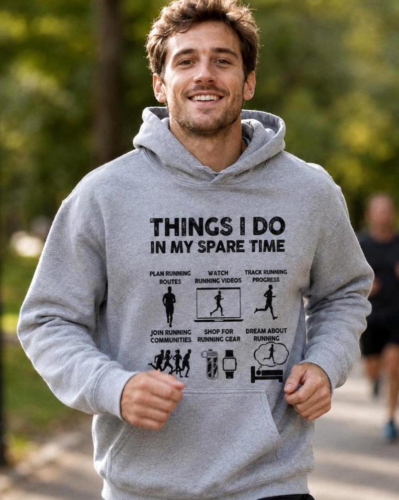 May include: A heather gray hooded sweatshirt featuring the black text "THINGS I DO IN MY SPARE TIME" above six icons and labels: "PLAN RUNNING ROUTES", "WATCH RUNNING VIDEOS", "TRACK RUNNING PROGRESS", "JOIN RUNNING COMMUNITIES", "SHOP FOR RUNNING GEAR", and "DREAM ABOUT RUNNING".