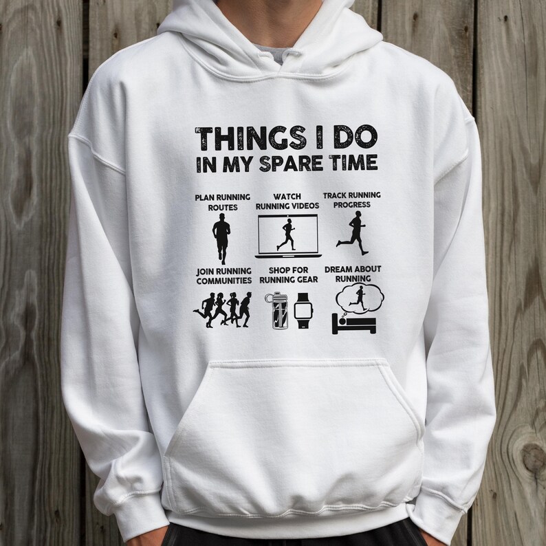 May include: A white hooded sweatshirt featuring black text and graphics that read: THINGS I DO IN MY SPARE TIME, with icons and labels for planning routes, watching videos, tracking progress, joining communities, shopping for gear, and dreaming about running.