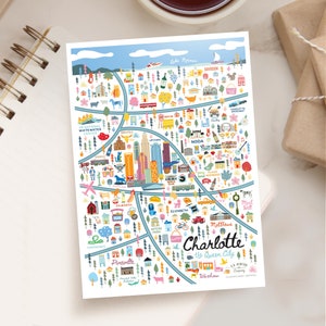 May include: A colorful illustrated map of Charlotte, North Carolina, with the text "The Queen City" and various landmarks and neighborhoods labeled. The map features a blue, green, and white color scheme with a white background.