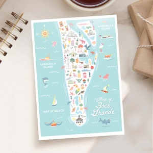 May include: A light blue map of Boca Grande, Florida, featuring illustrations of local landmarks, marine life, and recreational activities. The map includes the text "Village of Boca Grande" and "Gaspariila Island".