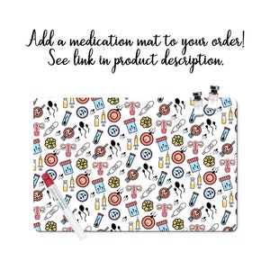 May include: White medication mat with a repeating pattern of colorful medical icons, including syringes, test tubes, sperm, eggs, and uteruses. The mat is designed to help organize medications and supplies.
