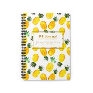 May include: A white spiral bound journal with a gold frame and the text "IVF Journal" and "Journey to Baby Johnson". The cover features a repeating pattern of yellow pineapples with green leaves on a white background.