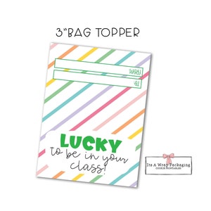 May include: A printable 3-inch bag topper with a rainbow striped background. The topper has two blank lines for writing "To" and "From" and the text "LUCKY to be in your class!" in green and black text.