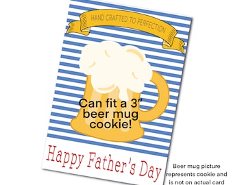 May include: A blue and white striped card with a yellow beer mug cookie cutter. The card says "Hand Crafted to Perfection" and "Can fit a 3" beer mug cookie!" and "Happy Father's Day".