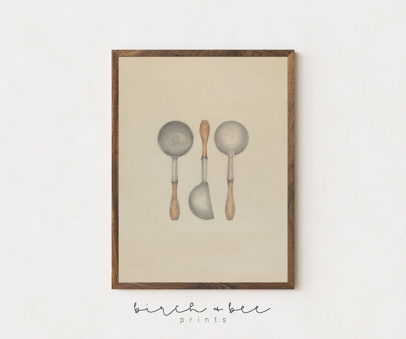 May include: A vintage-style print of three silver ladles with wooden handles on a beige background. The ladles are arranged in a vertical line with the handles pointing upwards. The print is framed in a dark wood frame.