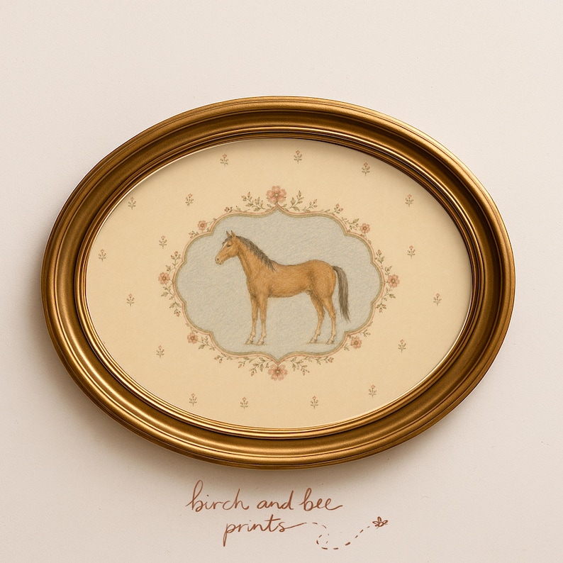 A vintage-style cottagecore illustration of a light brown chestnut horse standing inside an ornate, scalloped floral frame. The background is a soft cream color with a delicate pattern of tiny scattered pink flowers. The horse and frame feature intricate, hand-drawn textures, giving it a classic folk art and antique aesthetic.