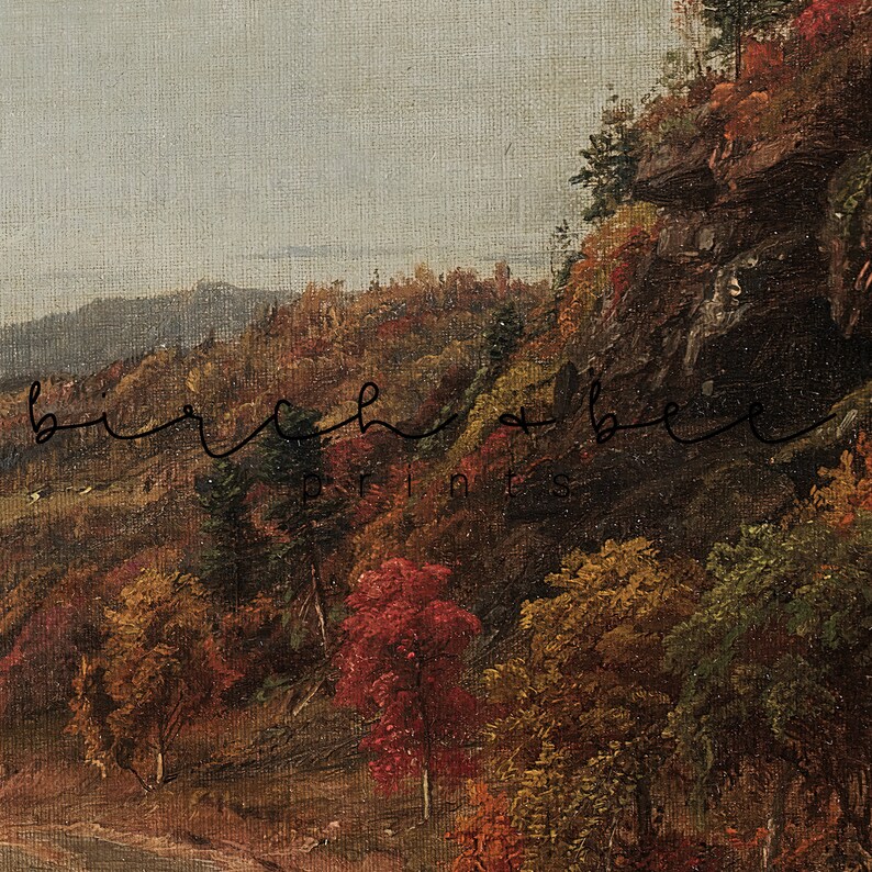 K&ouml;nnte beinhalten: Ein Gem&auml;lde, das eine Waldszene mit Herbstlaub in Rot-, Orange-, Gelb- und Gr&uuml;nt&ouml;nen zeigt. Die B&auml;ume befinden sich an einem Hang mit einer felsigen Klippe im Hintergrund. Der Himmel ist hellblau mit einigen Wolken.
